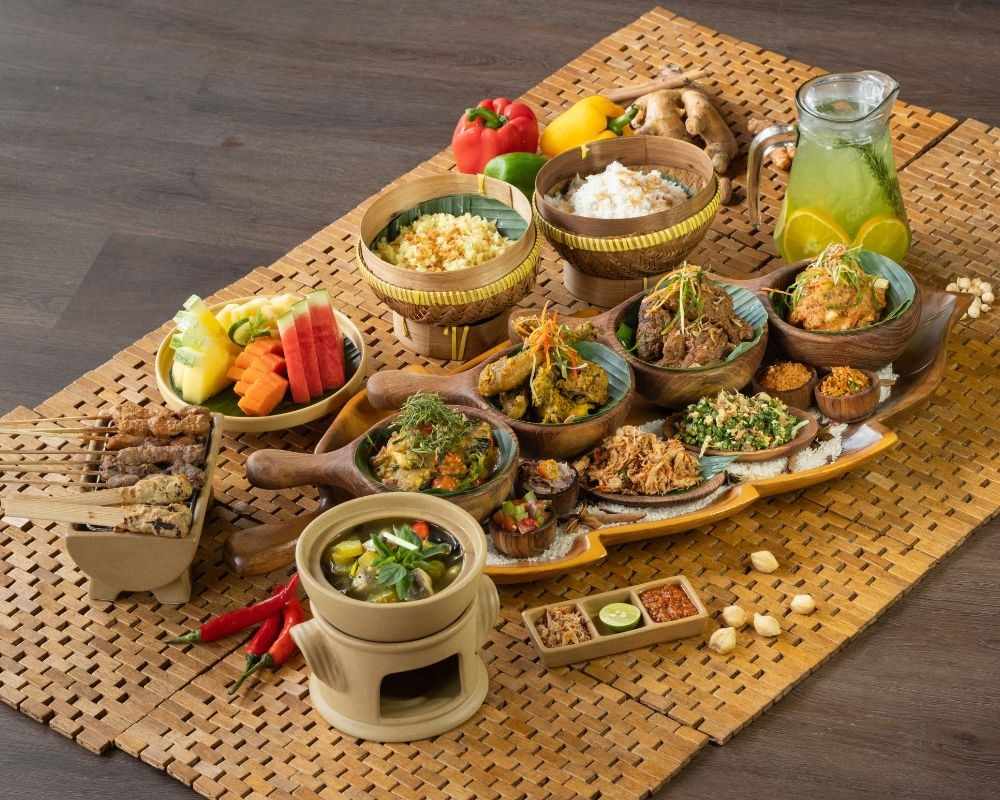 "Balinese traditional meal served in woven baskets and clay pots"