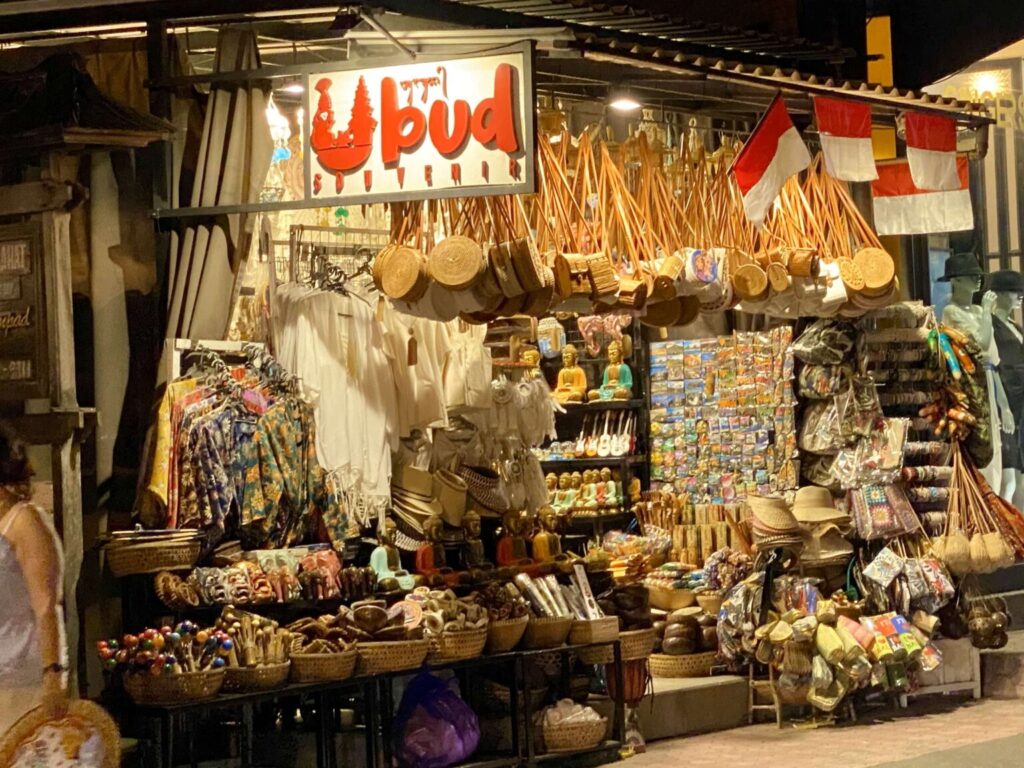 Souvenir stalls with woven bags at Ubud market in Bali at night
